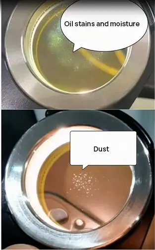 oildust or moisture appear on the lower protective lens of the laser cutter
